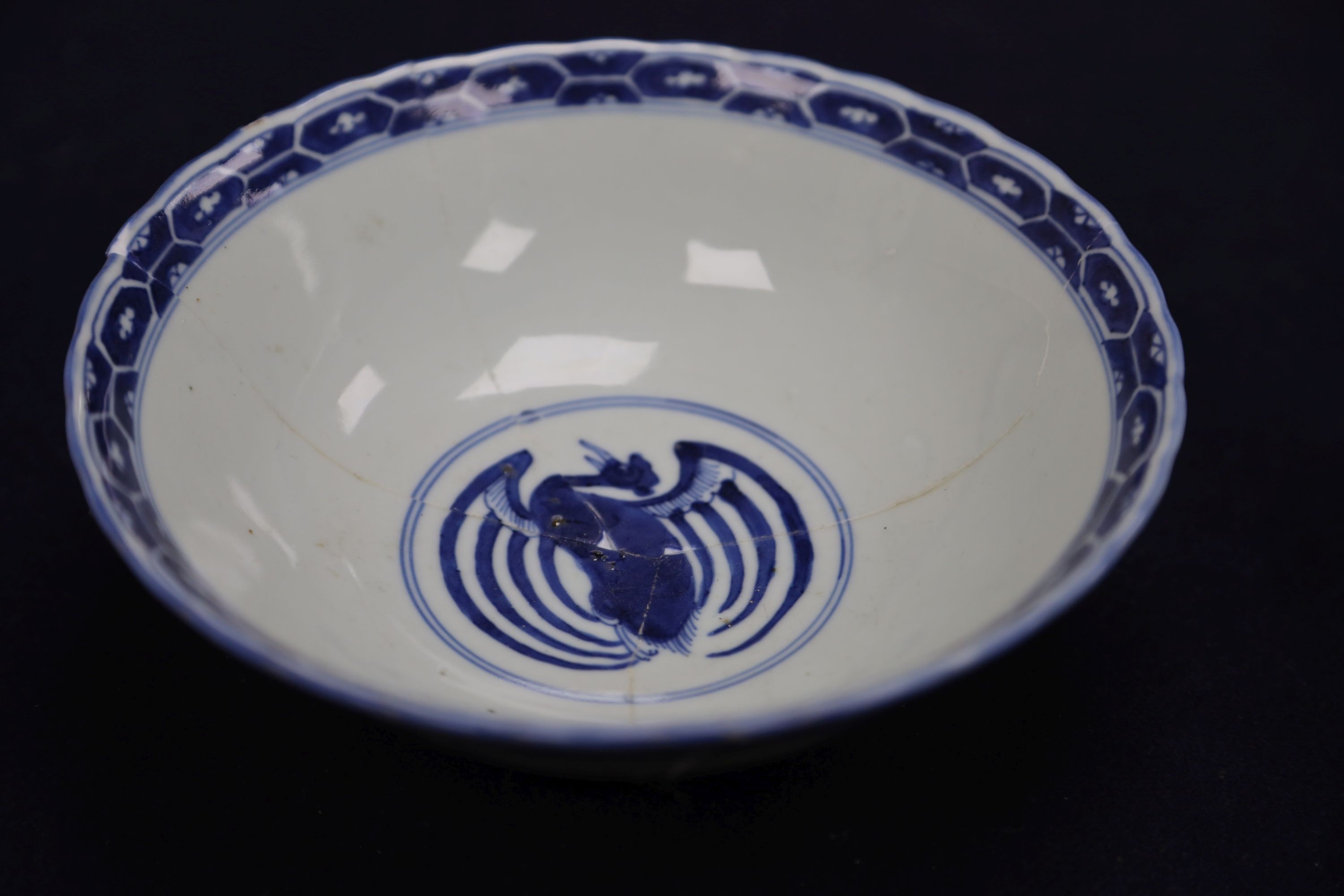 A Chinese blue and white landscape bowl, a/f and a Chinese blue and white 'dragon' dish, 18cm and 16.5cm